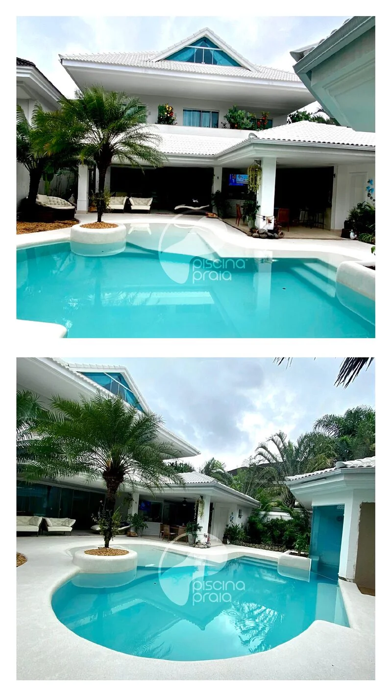Casa residencial com piscina de borda orgânica, água clara e coqueiro